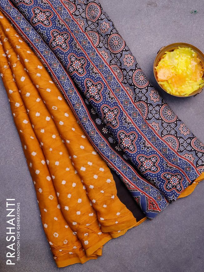 Modal silk saree mustard yellow and peacock blue with allover bandhani prints and ajrakh printed pallu