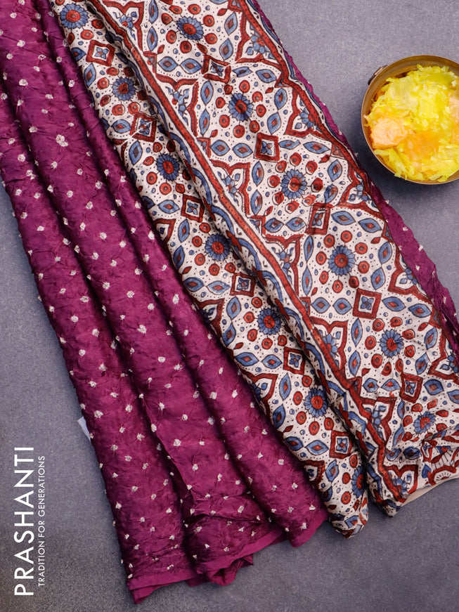 Modal silk saree purple shade and cream with allover bandhani prints and ajrakh printed pallu