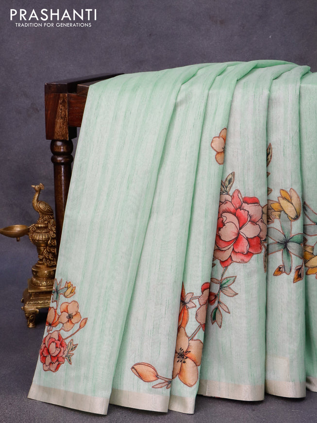 Semi tussar saree teal green with allover floral design applique work and zari woven border