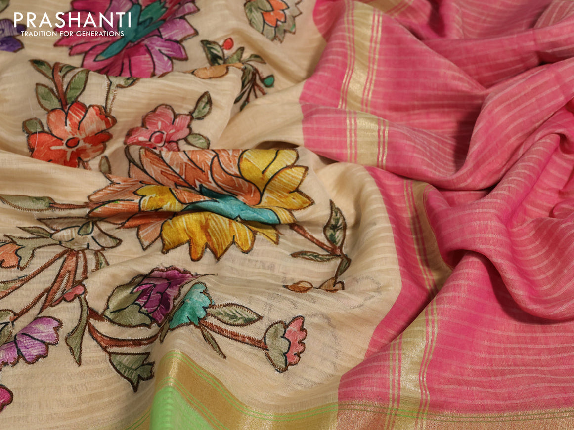 Semi chanderi saree sandal and pink with allover floral design applique work and zari woven simple border