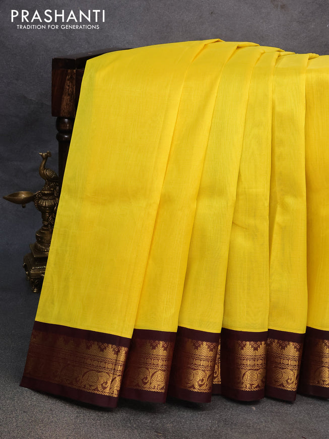 Silk cotton saree yellow and coffee brown with plain body and zari woven korvai border