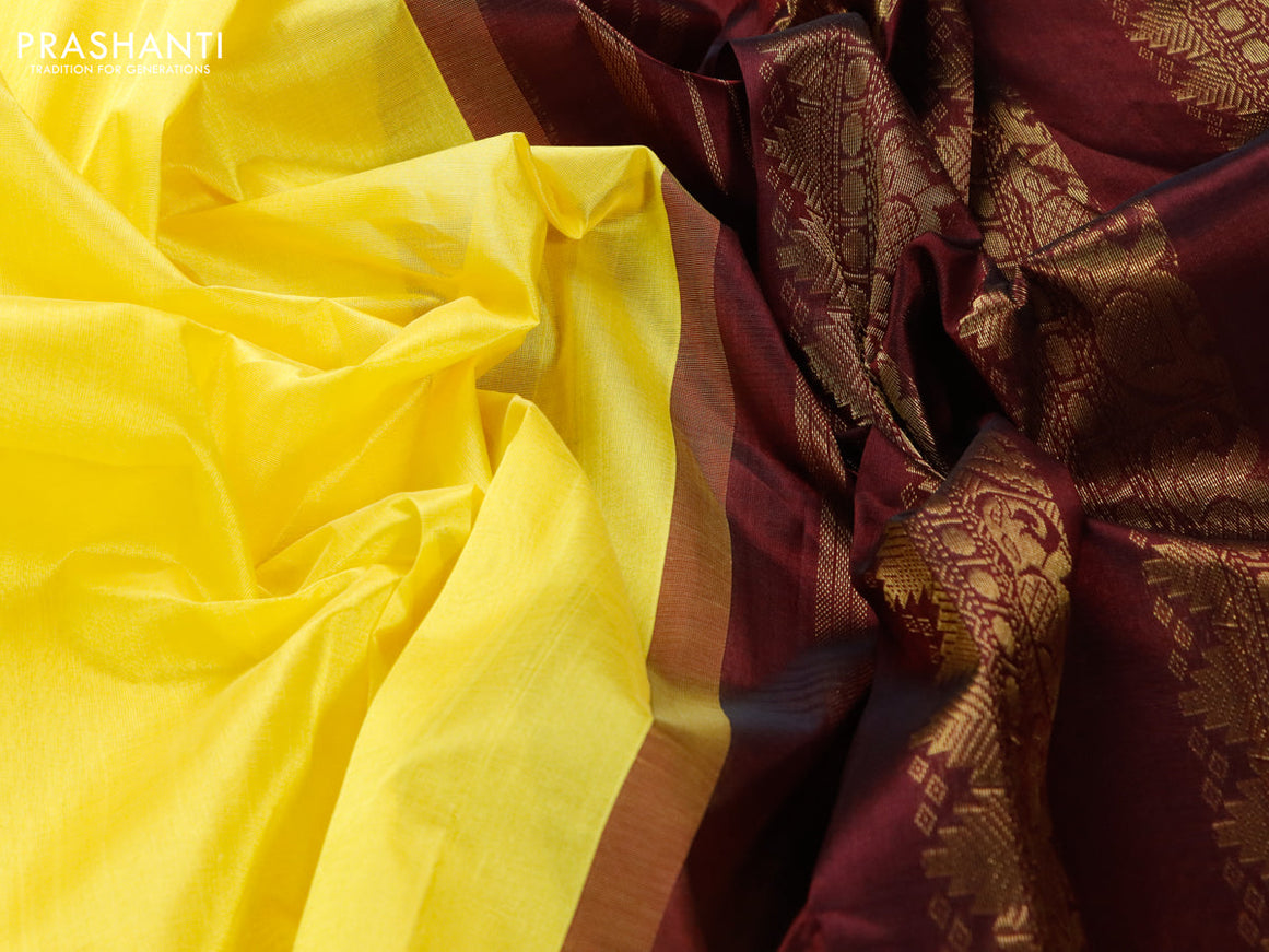 Silk cotton saree yellow and coffee brown with plain body and zari woven korvai border