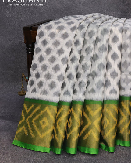 Ikat silk cotton saree off white and light green with allover ikat weaves and long ikat woven border