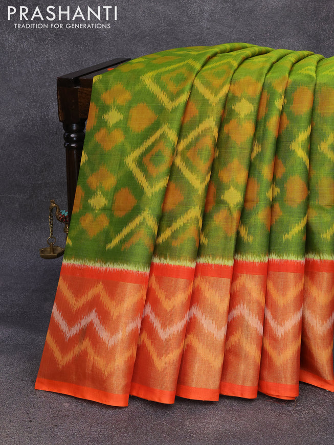 Ikat silk cotton saree light green and orange with allover ikat weaves and long ikat woven border