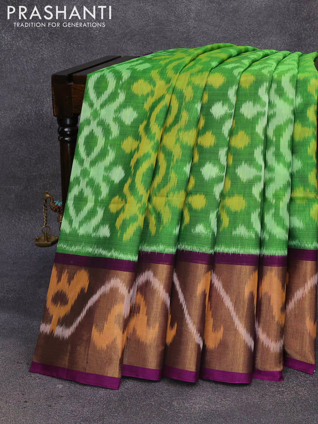 Ikat silk cotton saree green and purple with allover ikat weaves and long ikat woven border