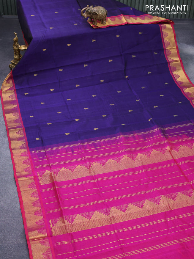 Silk cotton saree dark blue and magenta pink and temple design zari woven buttas and temple design zari woven border