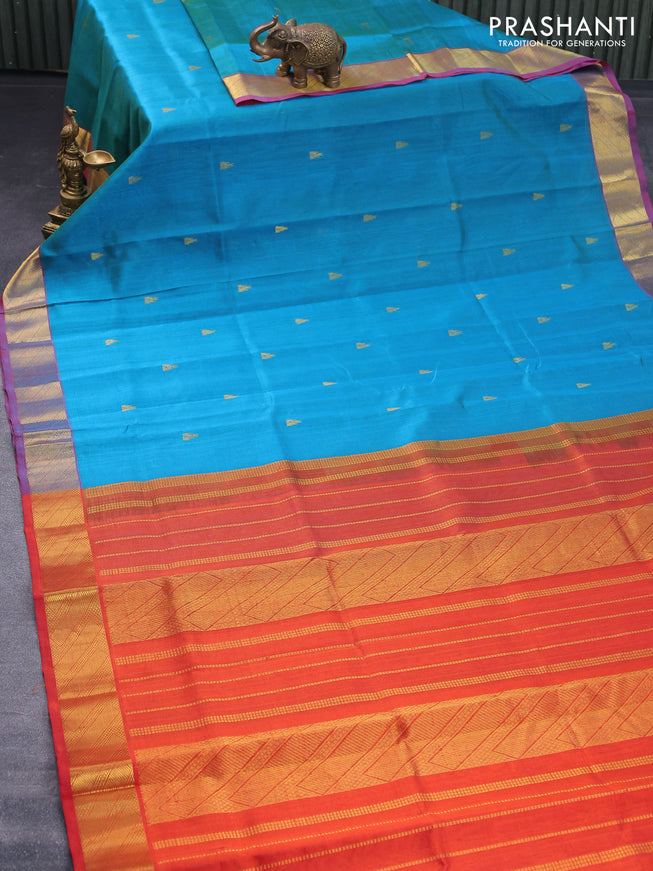 Silk cotton saree dual shade of teal blue and orange with zari woven buttas and zari woven border