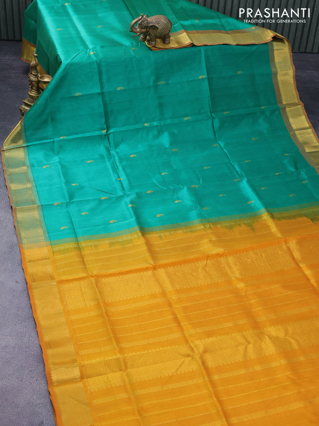 Silk cotton saree green and mustard yellow with paisley zari woven buttas and zari woven border