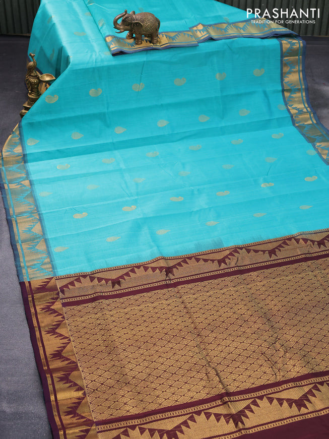 Silk cotton saree teal blue and brown with zari woven buttas and temple zari woven border