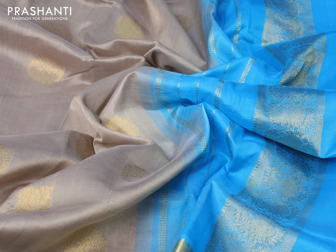 Silk cotton saree grey shade and light blue with zari woven buttas and paisley zari woven border