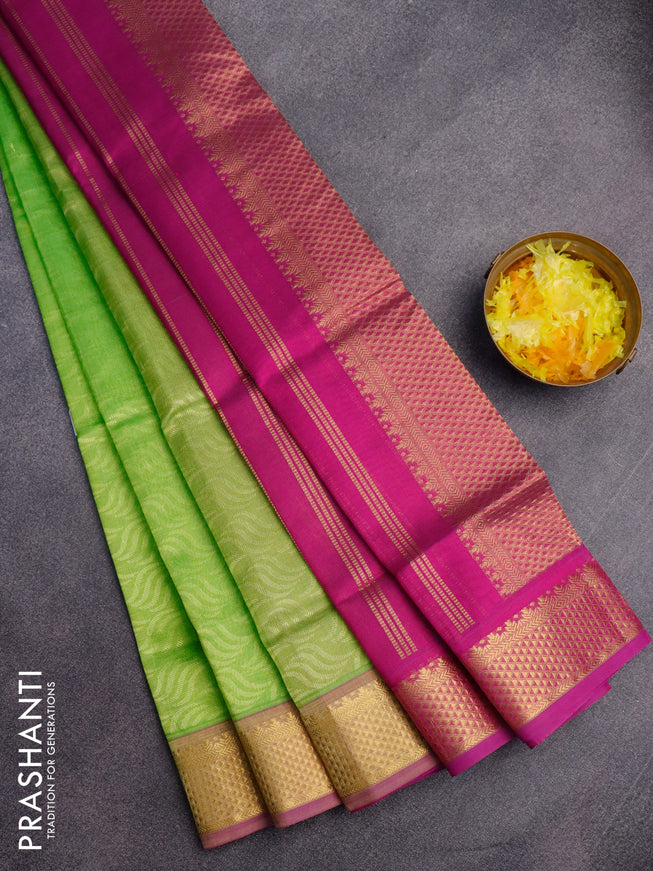 Silk cotton saree fluorescent green and magenta pink with allover self emboss jacquard and zari woven border