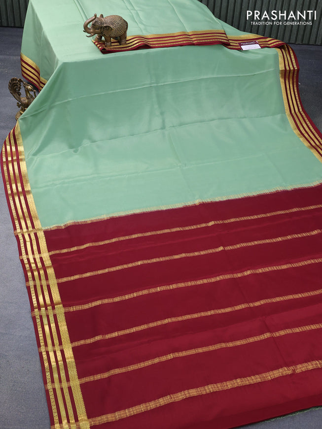 Mysore silk saree pastel green and maroon with plain body and zari woven border plain body