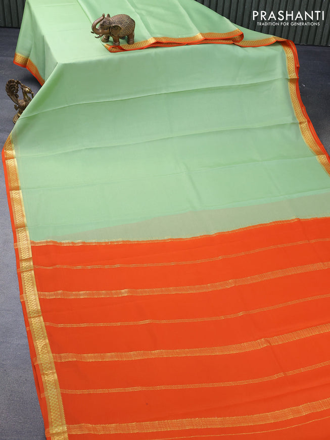 Mysore silk saree pastel green and orange with plain body and zari woven border plain body