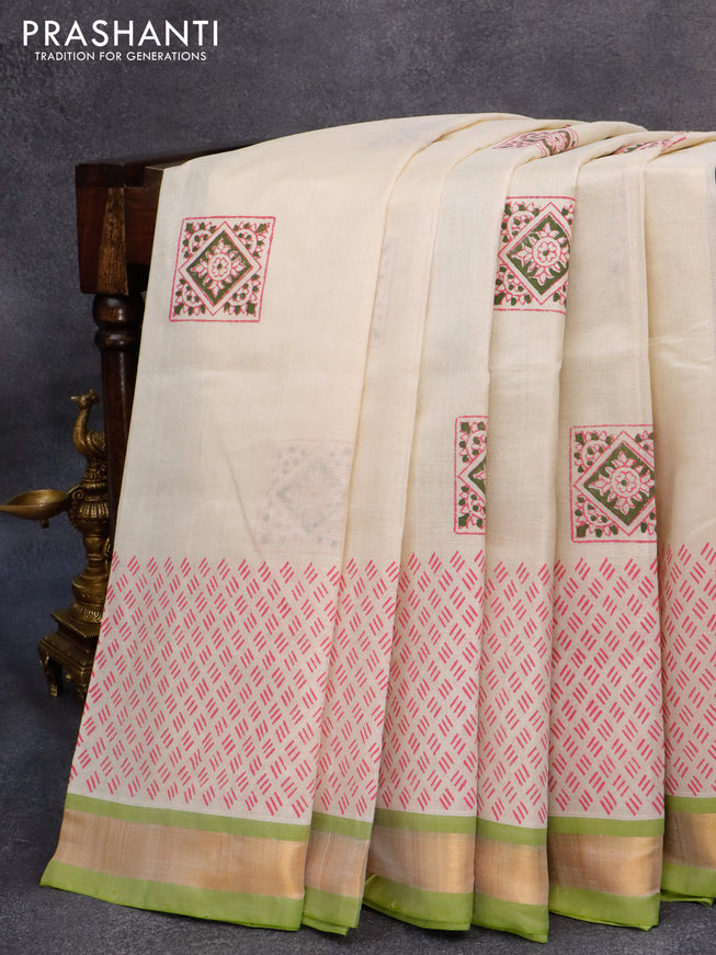 Silk cotton block printed saree cream and light green with allover prints and zari woven border