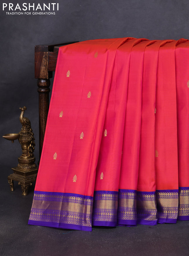 Pure kanchipuram silk saree dual shade of pinkish orange and violet with zari woven buttas and zari woven korvai border