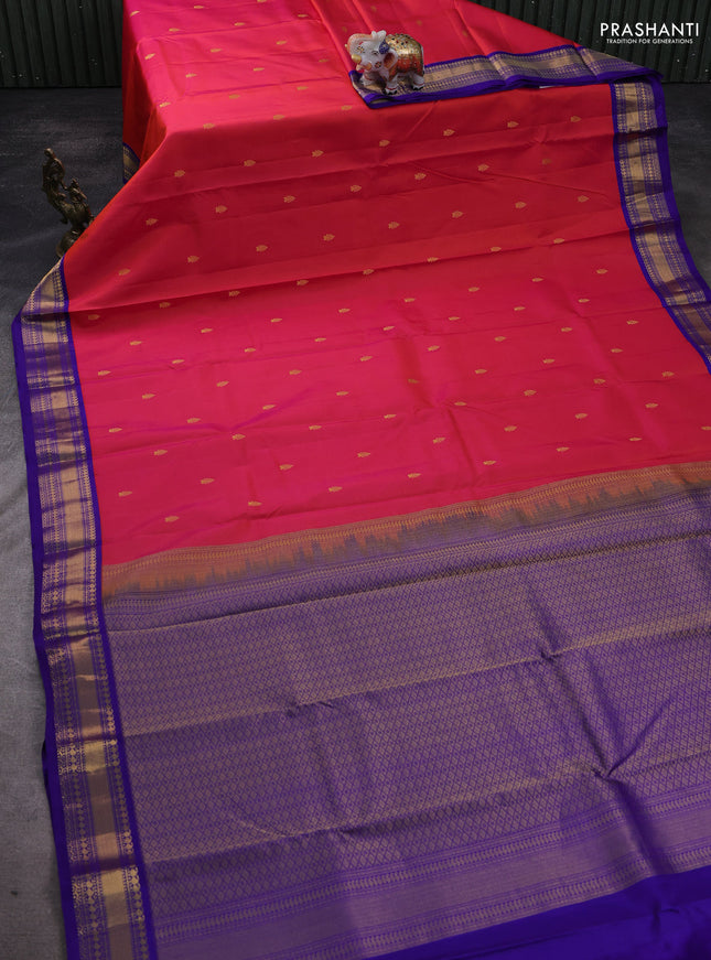 Pure kanchipuram silk saree dual shade of pinkish orange and violet with zari woven buttas and zari woven korvai border