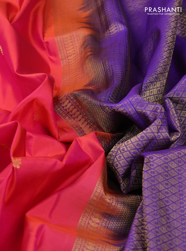 Pure kanchipuram silk saree dual shade of pinkish orange and violet with zari woven buttas and zari woven korvai border