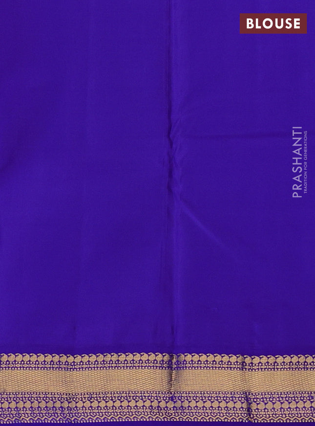 Pure kanchipuram silk saree dual shade of pinkish orange and violet with zari woven buttas and zari woven korvai border