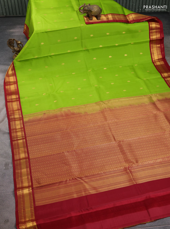Pure kanchipuram silk saree light green and maroon with zari woven buttas and zari woven korvai border