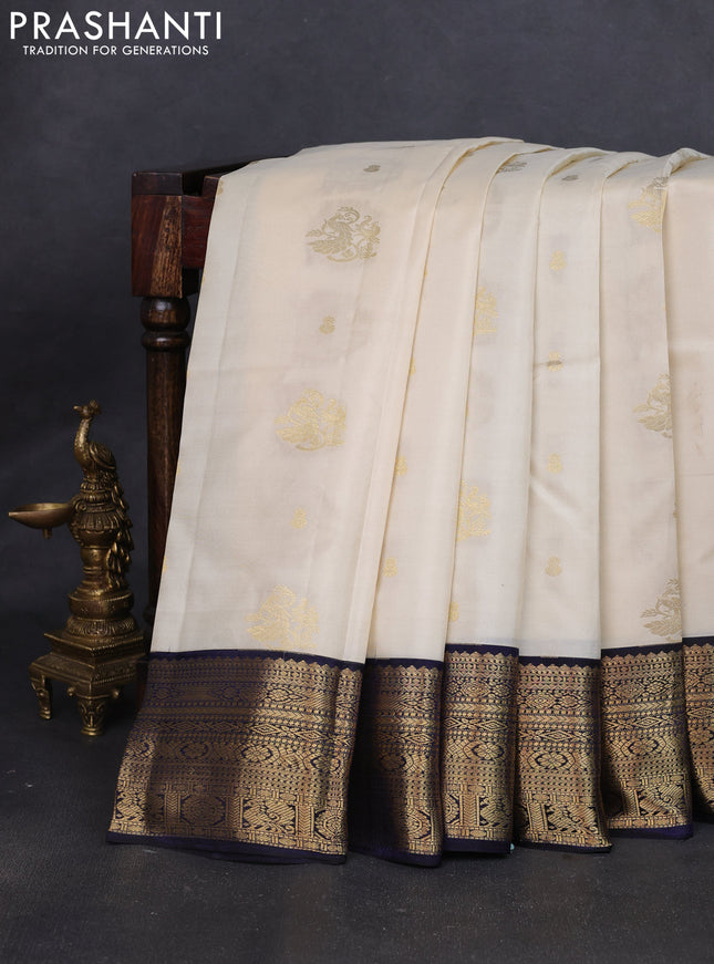 Pure kanchipuram silk saree cream and navy blue with zari woven buttas and rich zari woven korvai border