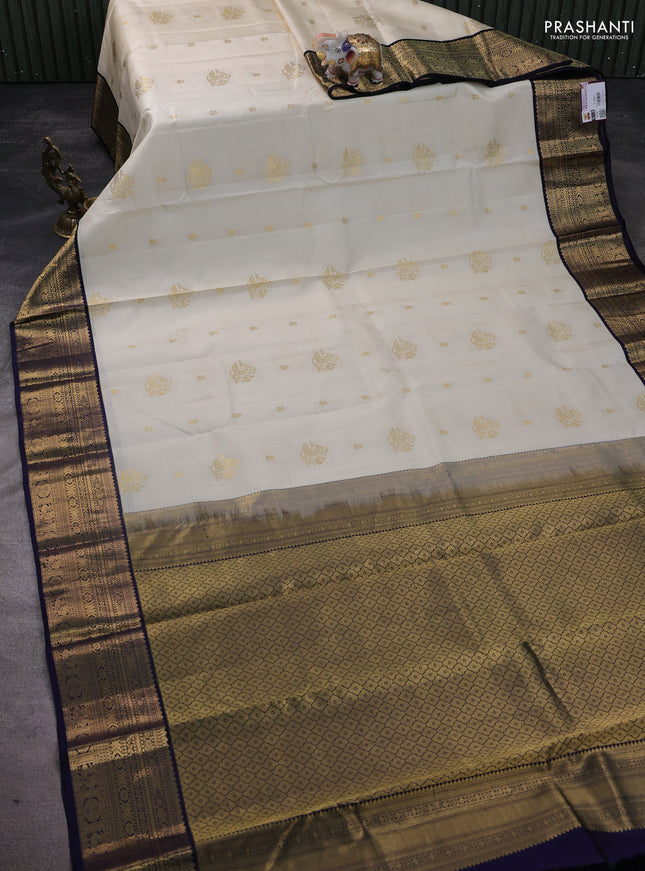 Pure kanchipuram silk saree cream and navy blue with zari woven buttas and rich zari woven korvai border