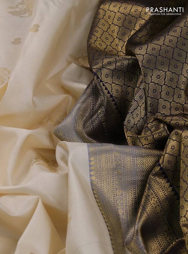 Pure kanchipuram silk saree cream and navy blue with zari woven buttas and rich zari woven korvai border
