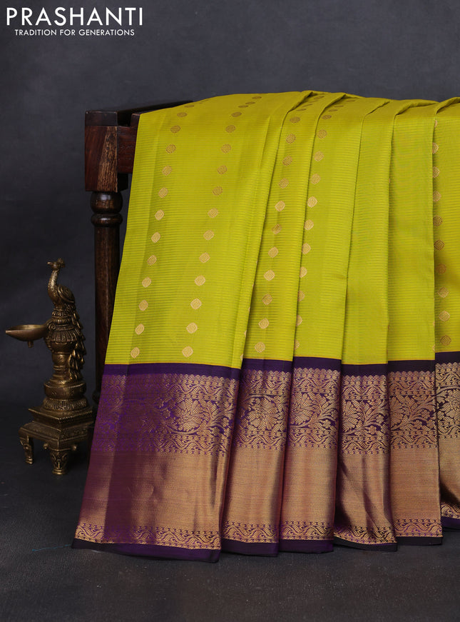 Pure kanchipuram silk saree lime yellow and purple with allover zari stripe weaves & buttas and long floral zari woven korvai border