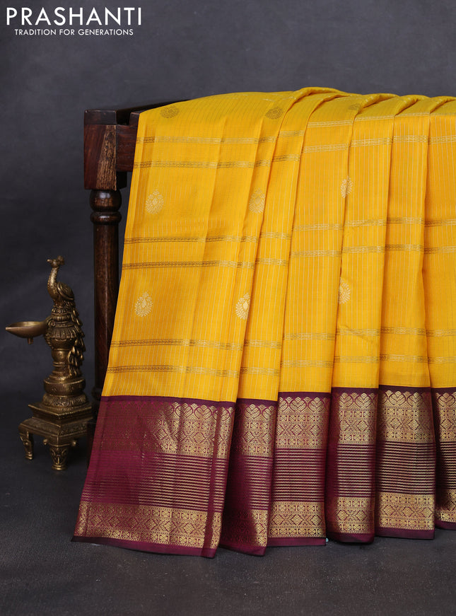 Pure kanchipuram silk saree yellow and wine shade with allover zari weaves & buttas and rich zari woven korvai border