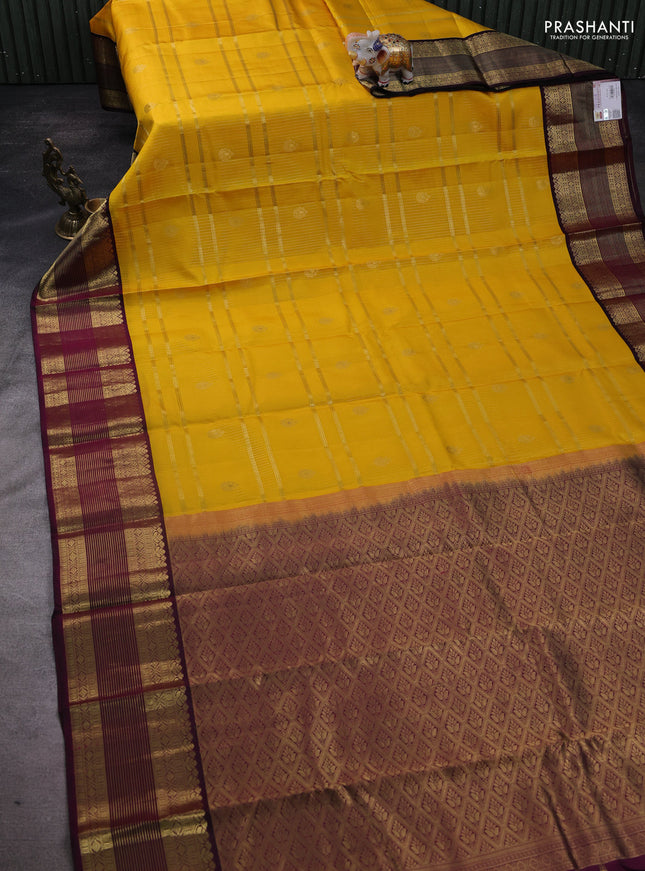 Pure kanchipuram silk saree yellow and wine shade with allover zari weaves & buttas and rich zari woven korvai border