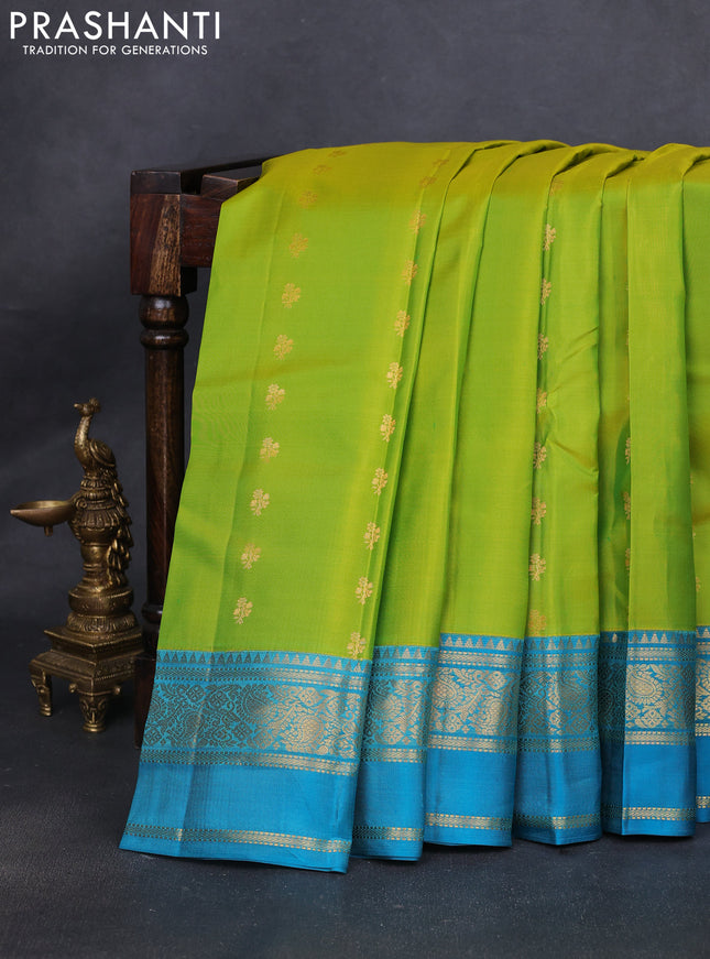 Pure kanchipuram silk saree lime green and teal blue shade with allover zari woven buttas and rettapet zari woven korvai border
