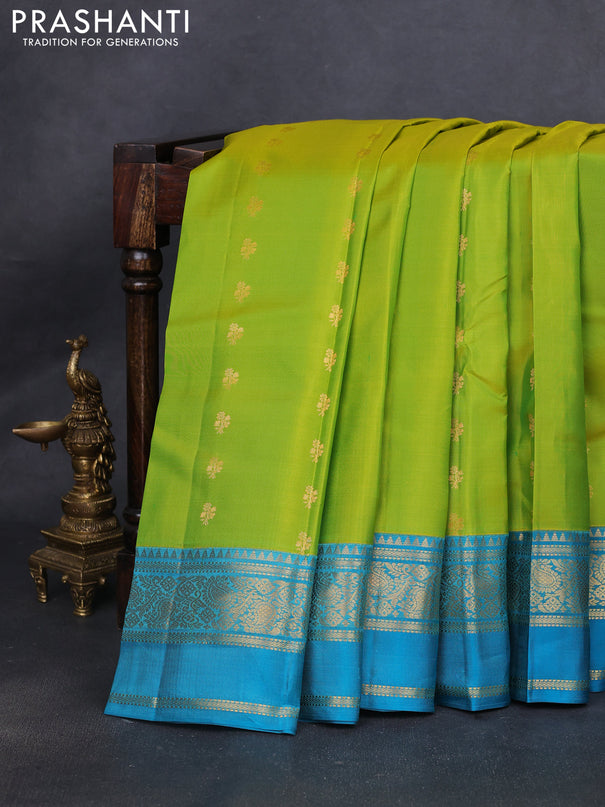 Pure kanchipuram silk saree lime green and teal blue shade with allover zari woven buttas and rettapet zari woven korvai border