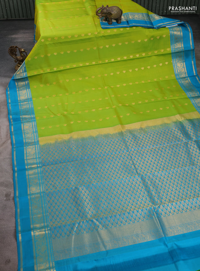 Pure kanchipuram silk saree lime green and teal blue shade with allover zari woven buttas and rettapet zari woven korvai border