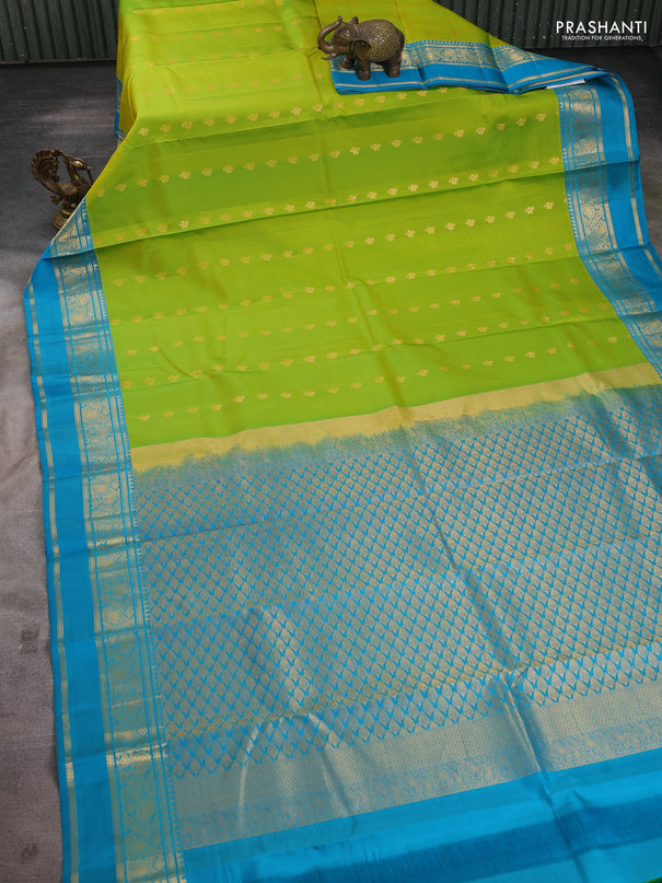 Pure kanchipuram silk saree lime green and teal blue shade with allover zari woven buttas and rettapet zari woven korvai border