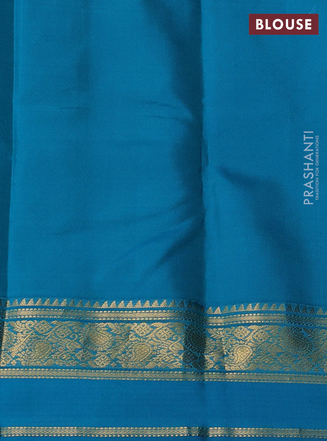 Pure kanchipuram silk saree violet and teal blue shade with allover zari woven buttas and rettapet zari woven korvai border