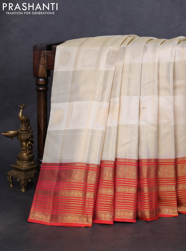 Pure kanchipuram silk saree cream and orange with allover zari checks & buttas and rich zari woven korvai border