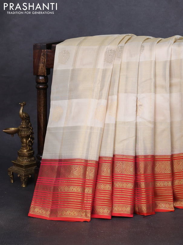 Pure kanchipuram silk saree cream and orange with allover zari checks & buttas and rich zari woven korvai border