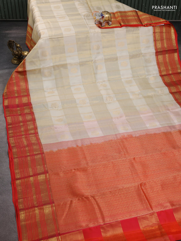 Pure kanchipuram silk saree cream and orange with allover zari checks & buttas and rich zari woven korvai border