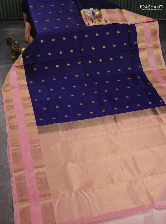 Pure kanchipuram silk saree navy blue and peach shade with zari woven buttas and long rettapet zari woven border