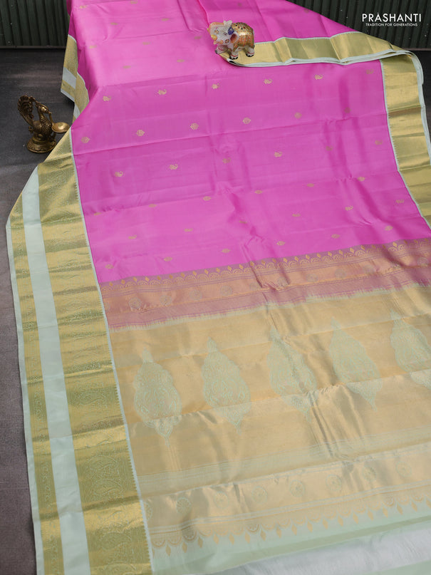 Pure kanchipuram silk saree lotus pink and mild pista green with zari woven buttas and long rettapet zari woven border