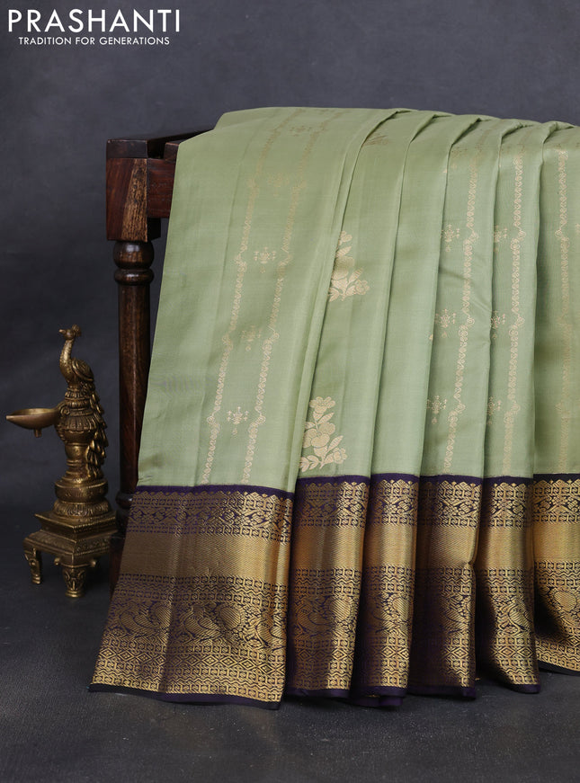 Pure kanchipuram silk saree pastel green and black with allover zari weaves & buttas and long zari woven korvai border