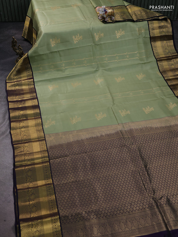 Pure kanchipuram silk saree pastel green and black with allover zari weaves & buttas and long zari woven korvai border