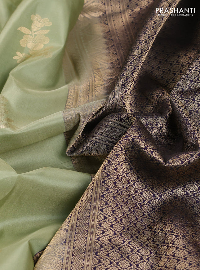 Pure kanchipuram silk saree pastel green and black with allover zari weaves & buttas and long zari woven korvai border