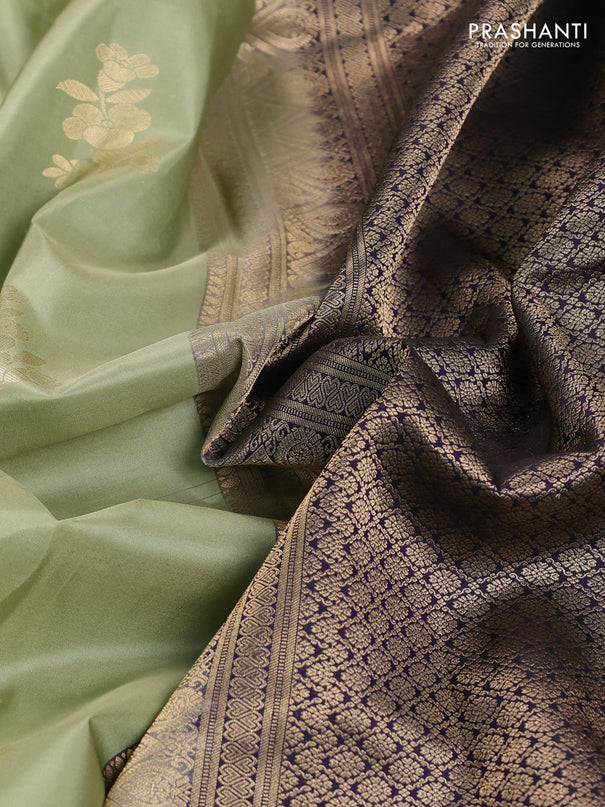 Pure kanchipuram silk saree pastel green and black with allover zari weaves & buttas and long zari woven korvai border