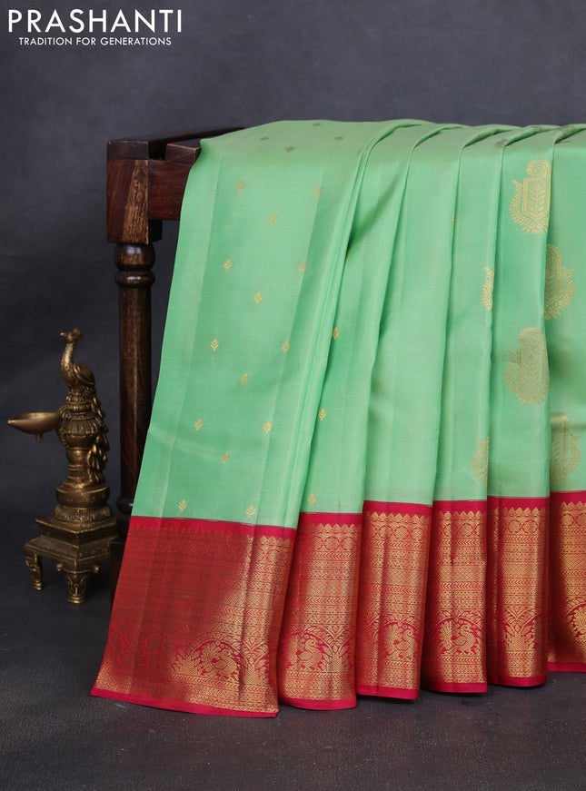 Pure kanchipuram silk saree pista green and reddish pink with zari woven buttas and rich zari woven korvai border