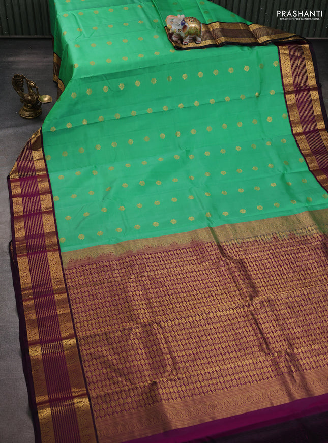 Pure kanchipuram silk saree teal green and purple with zari woven buttas and rich zari woven korvai border