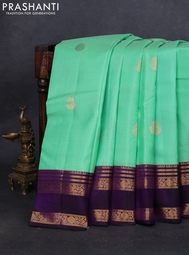 Pure kanchipuram silk saree teal green and violet with zari woven buttas and rettapet zari woven korvai border