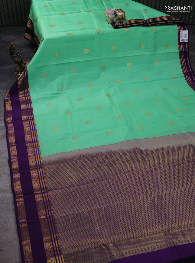 Pure kanchipuram silk saree teal green and violet with zari woven buttas and rettapet zari woven korvai border