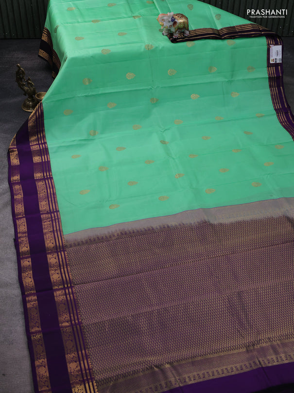 Pure kanchipuram silk saree teal green and violet with zari woven buttas and rettapet zari woven korvai border