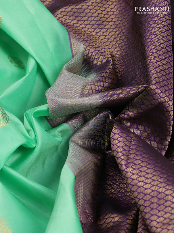 Pure kanchipuram silk saree teal green and violet with zari woven buttas and rettapet zari woven korvai border