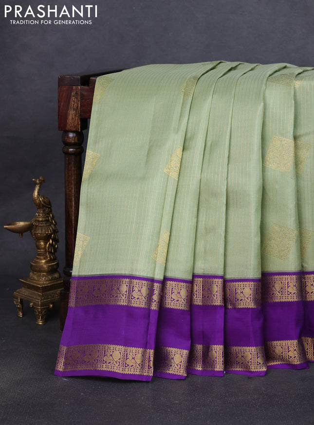 Pure kanchipuram silk saree pastel green and violet with allover zari weaves & buttas and rettapet zari woven korvai border